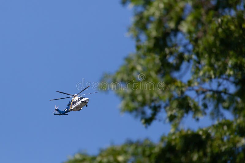 WOODBRIDGE, NEW JERSEY - June 1, 2020: A New Jersey State Police helicopter circles the area during late spring. WOODBRIDGE, NEW JERSEY - June 1, 2020: A New Jersey State Police helicopter circles the area during late spring