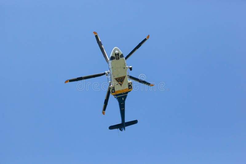 WOODBRIDGE, NEW JERSEY - June 1, 2020: A New Jersey State Police helicopter circles the area during late spring. WOODBRIDGE, NEW JERSEY - June 1, 2020: A New Jersey State Police helicopter circles the area during late spring