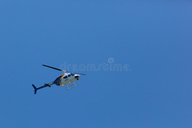 WOODBRIDGE, NEW JERSEY - June 1, 2020: A New Jersey State Police helicopter circles the area during late spring. WOODBRIDGE, NEW JERSEY - June 1, 2020: A New Jersey State Police helicopter circles the area during late spring