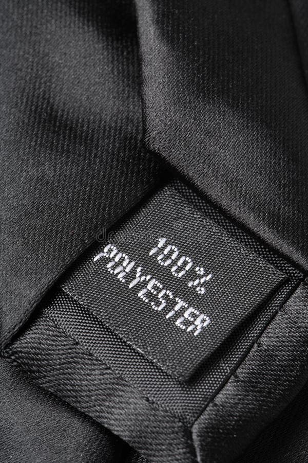 100% polyester label on a black tie. 100% polyester label on a black tie