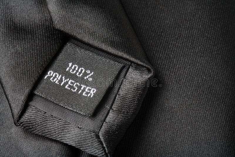 100% Polyester label on a tie. 100% Polyester label on a tie