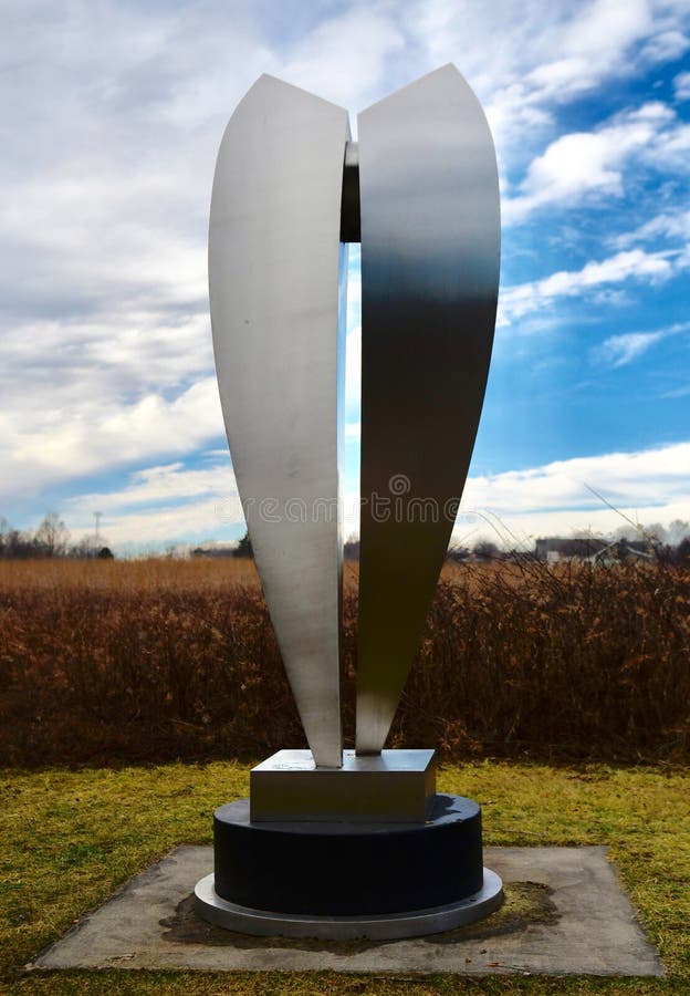 This is a Winter picture of a piece of public art titled: Position #1, on exhibit at Wendell Sculpture Garden at Meadowbrook Park located in Urbana, Illinois in Champaign County. This stainless steel and painted concrete sculpture was created by Ron Gard in 2006. This picture was taken on January 4, 2019. This is a Winter picture of a piece of public art titled: Position #1, on exhibit at Wendell Sculpture Garden at Meadowbrook Park located in Urbana, Illinois in Champaign County. This stainless steel and painted concrete sculpture was created by Ron Gard in 2006. This picture was taken on January 4, 2019.