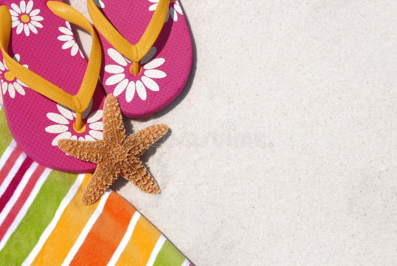 Flip flops on pretty beach towel by sand and starfish. Flip flops on pretty beach towel by sand and starfish
