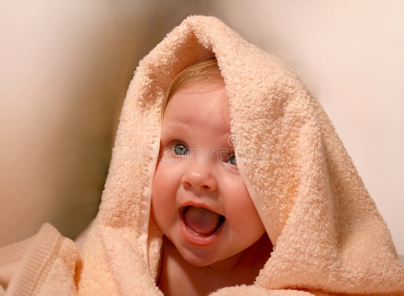 Porttrait smiling baby in bath towel. Porttrait smiling baby in bath towel