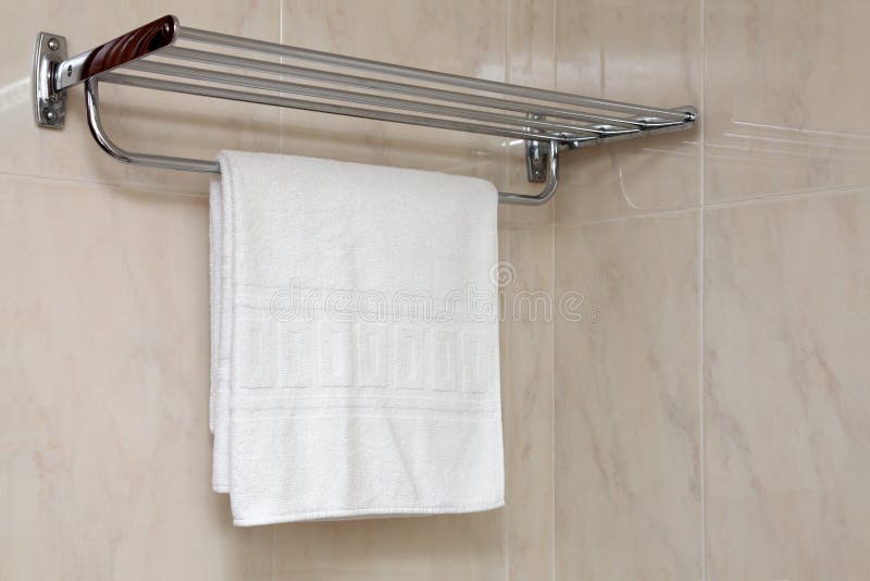 Pure white towel on a hanger. Pure white towel on a hanger