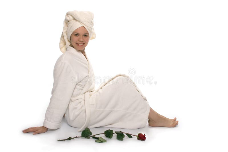 Beauty girl in towel relaxing after shower on white background. Beauty girl in towel relaxing after shower on white background