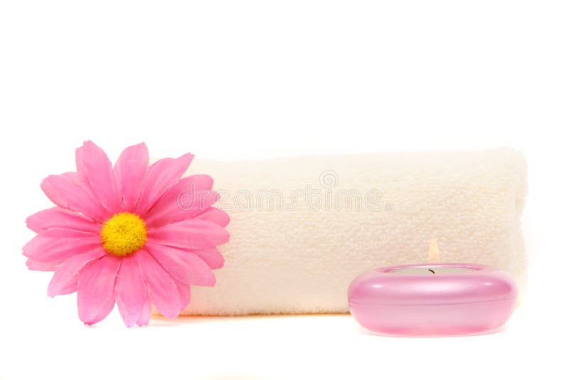 Spa towel, gerbera daisy and candle isolated on white background. Spa towel, gerbera daisy and candle isolated on white background