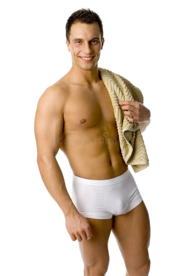 Muscular man's standing with towel on his shoulder. Isolated on white in studio. Muscular man's standing with towel on his shoulder. Isolated on white in studio.