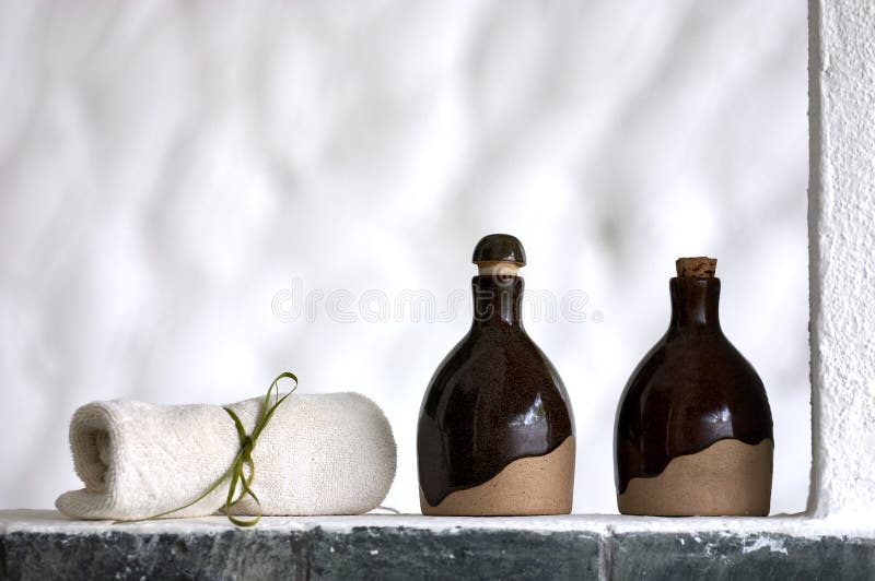 Shampoo, body lotion and towel in the spa. Shampoo, body lotion and towel in the spa
