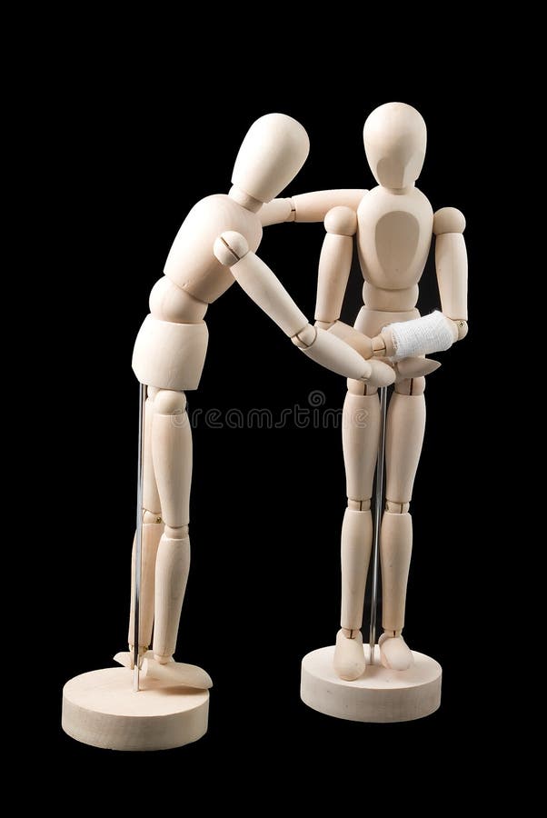 Two little mannequins without faces positioned in a posture of one caring for the other one because it is injured. Two little mannequins without faces positioned in a posture of one caring for the other one because it is injured.