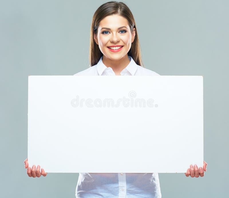 Portrait of business woman holding sign board. studio background. Smiling model with long hair. Business person. Portrait of business woman holding sign board. studio background. Smiling model with long hair. Business person.