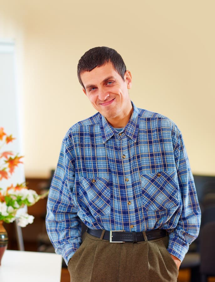 Portrait of cheerful adult smiling man with disability in rehabilitation center. Portrait of cheerful adult smiling man with disability in rehabilitation center