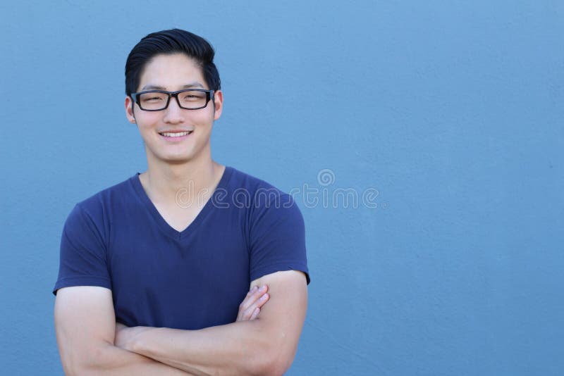 Portrait of a handsome Asian man with glasses crossing his arms. Portrait of a handsome Asian man with glasses crossing his arms.