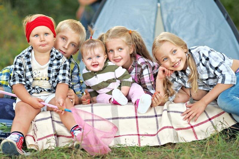 Portrait of young children on a camping holiday. Portrait of young children on a camping holiday