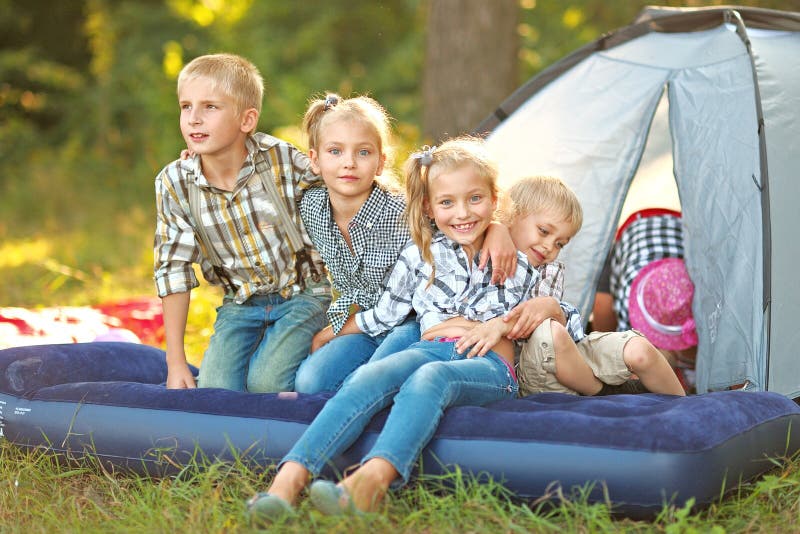 Portrait of young children on a camping holiday. Portrait of young children on a camping holiday