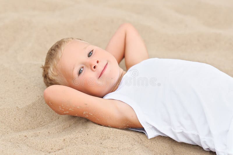 Portrait of boy on the beach in summer. Portrait of boy on the beach in summer