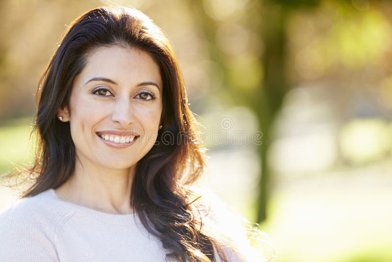 Portrait Of Attractive Hispanic Woman In Countryside Smiling At Camera. Portrait Of Attractive Hispanic Woman In Countryside Smiling At Camera