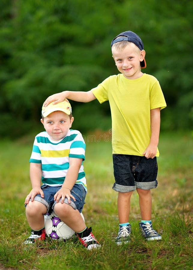 Portrait of two little boys friends in summer. Portrait of two little boys friends in summer