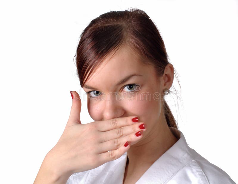 Girl in kimono closing her mouth and looking shy (japanese body language). Isolated studio shot. Girl in kimono closing her mouth and looking shy (japanese body language). Isolated studio shot