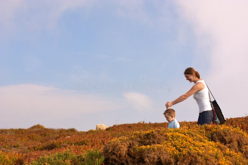 Follow the guide. Small cute boy leading his mother to some destination. Follow the guide. Small cute boy leading his mother to some destination.