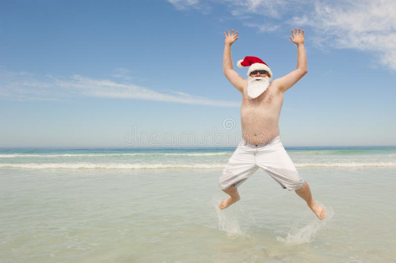 Потеха рождества пляжа Santa Claus тропическая стоковая фотография rf