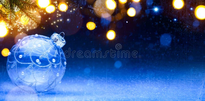 Blue Christmas background; Christmas composition with Xmas decoration on snow. Blue Christmas background; Christmas composition with Xmas decoration on snow