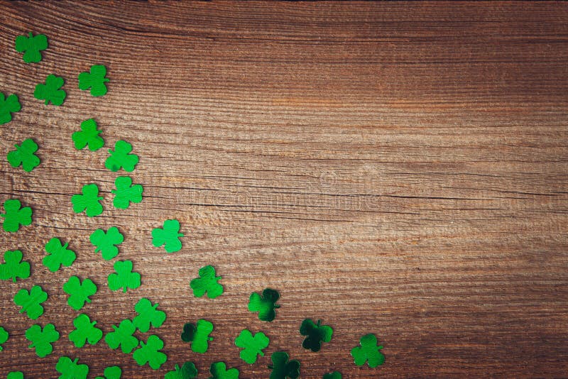 Cloverleaf background st.patrick´s day with green cloverleaves on wooden background. Cloverleaf background st.patrick´s day with green cloverleaves on wooden background