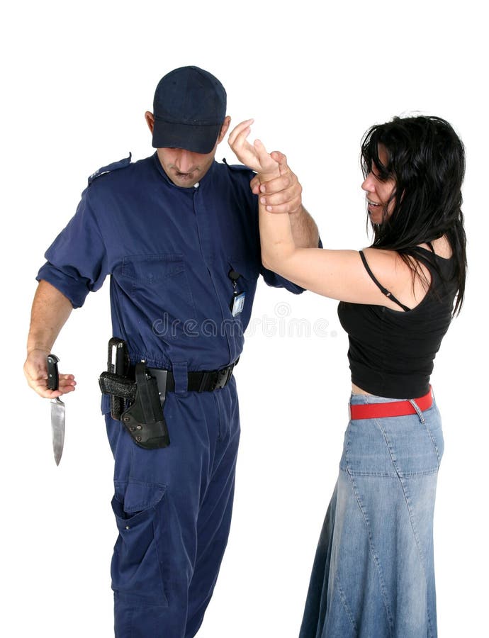 Officer apprehends and disarms a knife from a rough female criminal. Officer apprehends and disarms a knife from a rough female criminal