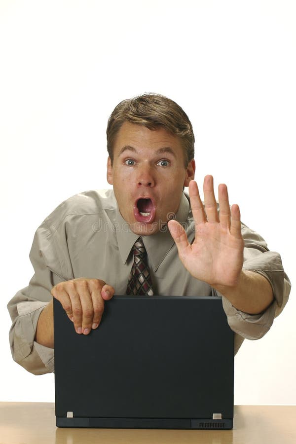 A man attempts to hide something on his computer. A man attempts to hide something on his computer