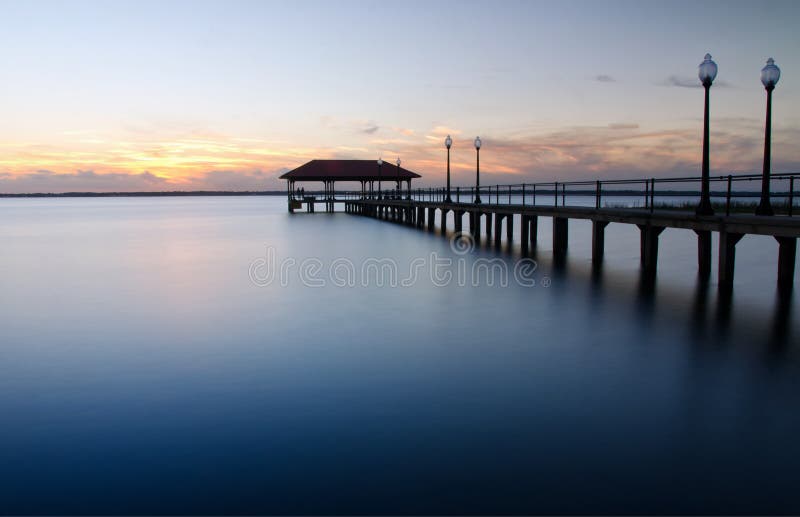 A city pier in Florida at sunset. A city pier in Florida at sunset