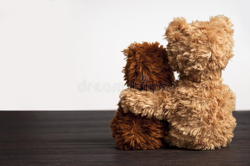 Friendship - two teddy bears holding in one's arms. Friendship - two teddy bears holding in one's arms
