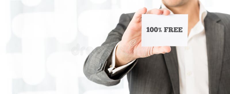 Closeup of salesman showing a white business card with 100% free sign. Conceptual of business marketing and retail. Closeup of salesman showing a white business card with 100% free sign. Conceptual of business marketing and retail.