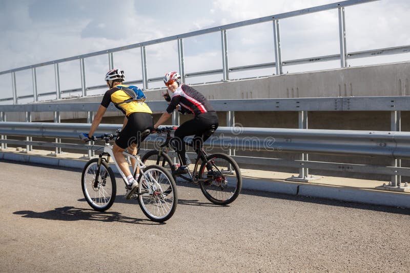 Two professional cyclists taking a training ride. Two professional cyclists taking a training ride