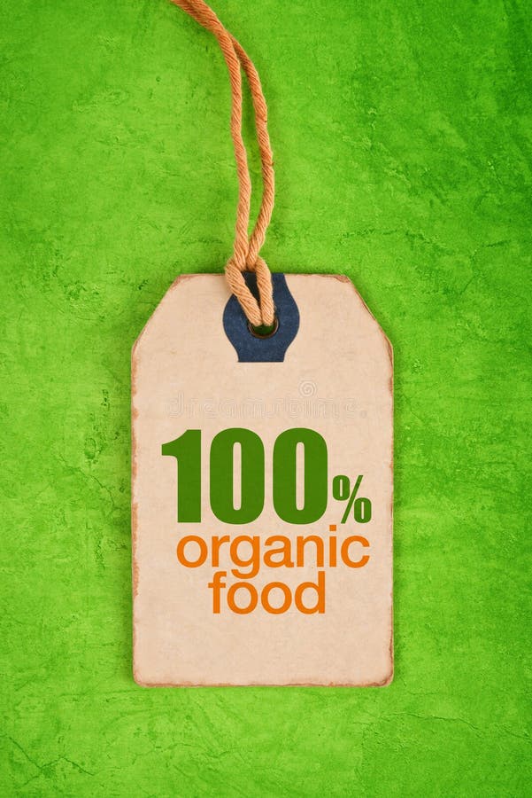 100 Percent Organic Food on Vintage Price Label Tag Label on Green Grunge Textured Backgroundas, Top View. 100 Percent Organic Food on Vintage Price Label Tag Label on Green Grunge Textured Backgroundas, Top View.