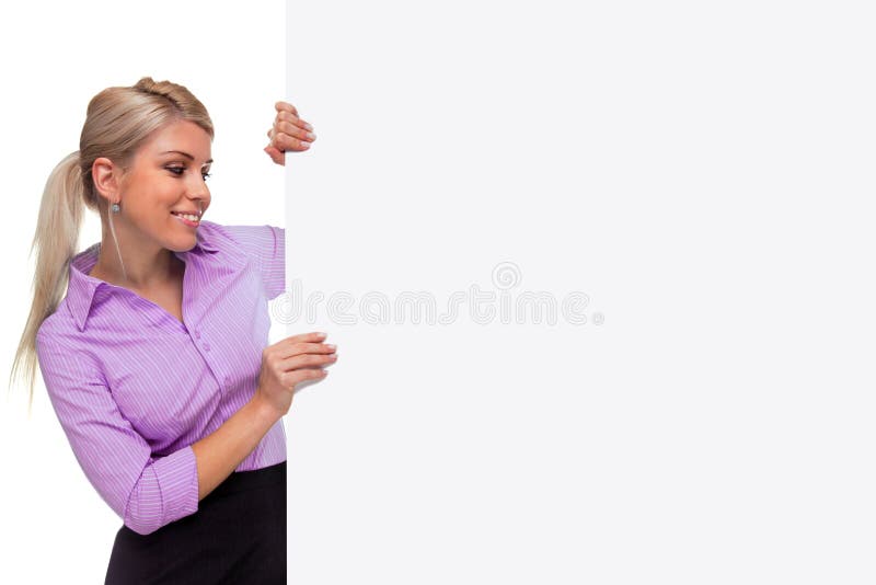 An attractive blond woman holding the side of a blank billboard looking at the blank space, the board is a uniform color so you can make it larger if you wish to add your own image or message. An attractive blond woman holding the side of a blank billboard looking at the blank space, the board is a uniform color so you can make it larger if you wish to add your own image or message.