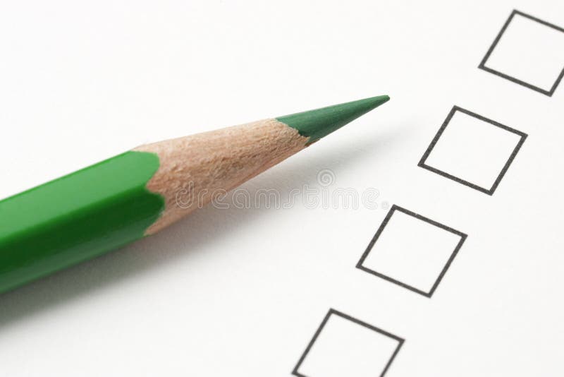 Check box survey with green pencil. Focus on tip of pencil. Check box survey with green pencil. Focus on tip of pencil