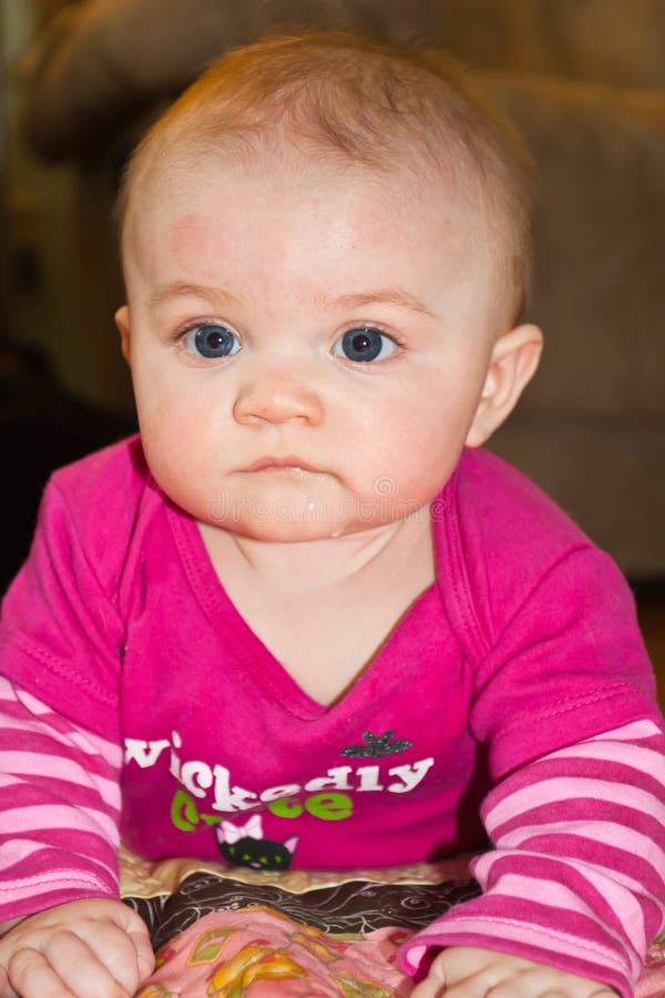 Five month old infant girl on her tummy. Five month old infant girl on her tummy.