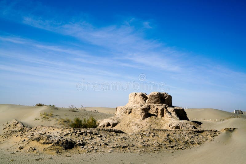 Rawak is a Buddhist stupa located on the southern rim of the Taklamakan Desert in China, along the famous trade route known as the Silk Road in the first millennium Kingdom of Khotan. Around the stupa there are other smaller structures which were originally decorated with a large number of colossal statues. The courtyard of the temple was surrounded by a wall, which contained terracotta relieves and some wall-paintings. The stupa and other structures form a three-dimensional mandala. The site is now about 40 km north of the modern city of Hotan in Xinjiang Autonomous Region of the People`s Republic of China.

The archaeologist Aurel Stein first visited Rawak during his First Central Asian expedition in April 1901. Rawak is a Buddhist stupa located on the southern rim of the Taklamakan Desert in China, along the famous trade route known as the Silk Road in the first millennium Kingdom of Khotan. Around the stupa there are other smaller structures which were originally decorated with a large number of colossal statues. The courtyard of the temple was surrounded by a wall, which contained terracotta relieves and some wall-paintings. The stupa and other structures form a three-dimensional mandala. The site is now about 40 km north of the modern city of Hotan in Xinjiang Autonomous Region of the People`s Republic of China.

The archaeologist Aurel Stein first visited Rawak during his First Central Asian expedition in April 1901.