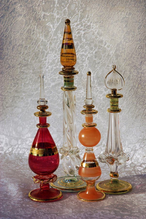 Beautiful  oriental perfume flacons in different colors decorated with golden patters. Beautiful  oriental perfume flacons in different colors decorated with golden patters
