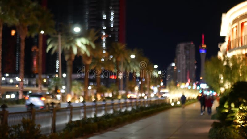 Defocused fabulous Las Vegas Strip boulevard, luxury casino and hotel, gambling area in Nevada, USA. Nightlife and traffic near Fremont street in tourist money playing resort. Neon lights of sin city. Defocused fabulous Las Vegas Strip boulevard, luxury casino and hotel, gambling area in Nevada, USA. Nightlife and traffic near Fremont street in tourist money playing resort. Neon lights of sin city