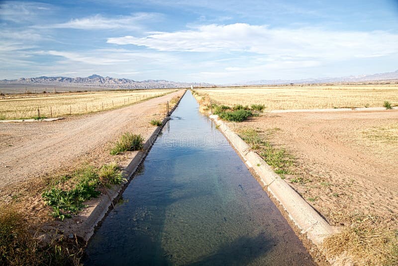 Water diverted from the Colorado River flows through a concrete agricultural irrigation ditch in the California desert. Water diverted from the Colorado River flows through a concrete agricultural irrigation ditch in the California desert.