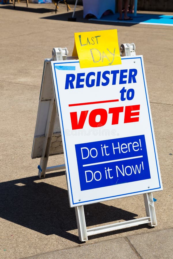 Sign reading Last Day Register to Vote trying to get voters to signup for political voting registration. Sign reading Last Day Register to Vote trying to get voters to signup for political voting registration.