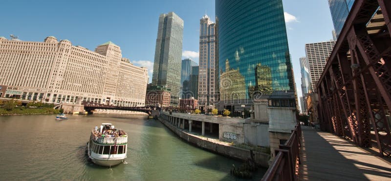 Boat taking group of tourists on architectural tour on the Chicago River. Boat taking group of tourists on architectural tour on the Chicago River