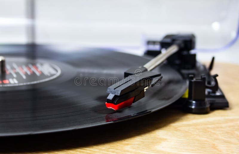 Vinyl is back in. a record player with the stylus on the record. Vinyl is back in. a record player with the stylus on the record