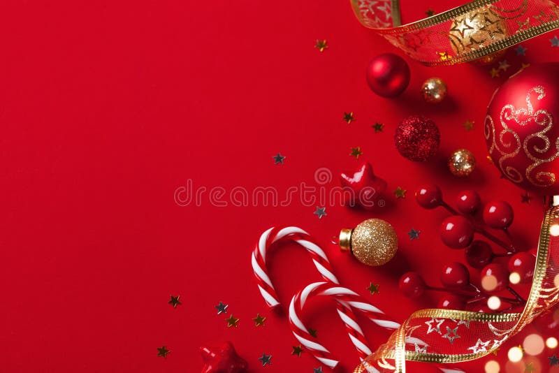 Christmas card or banner. Christmas holiday decorations on red background. Christmas card or banner. Christmas holiday decorations on red background