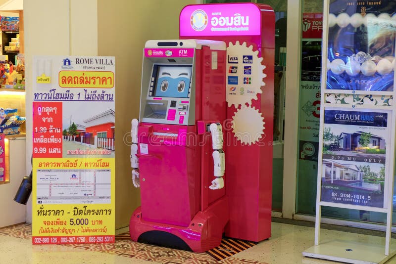 Розовый робот ATM стоковое изображение Розовый робот ATM стоковое изображение