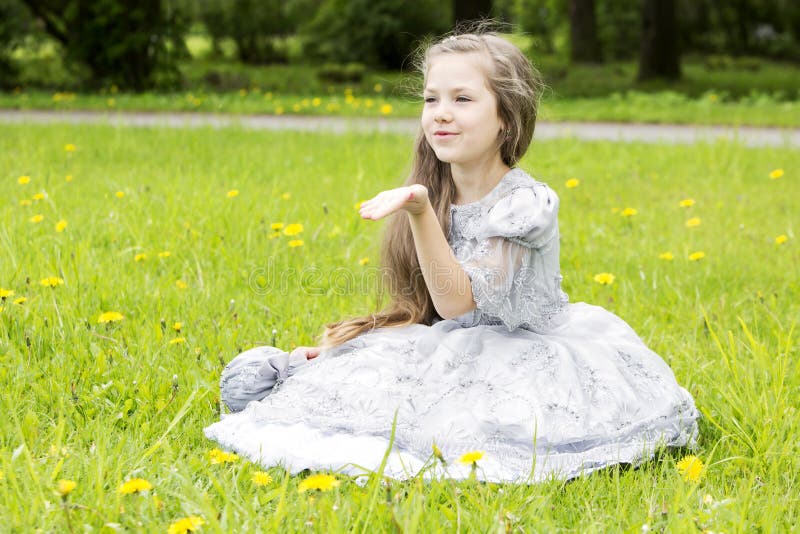 Lovely little princess sending kisses by air. Lovely little princess sending kisses by air