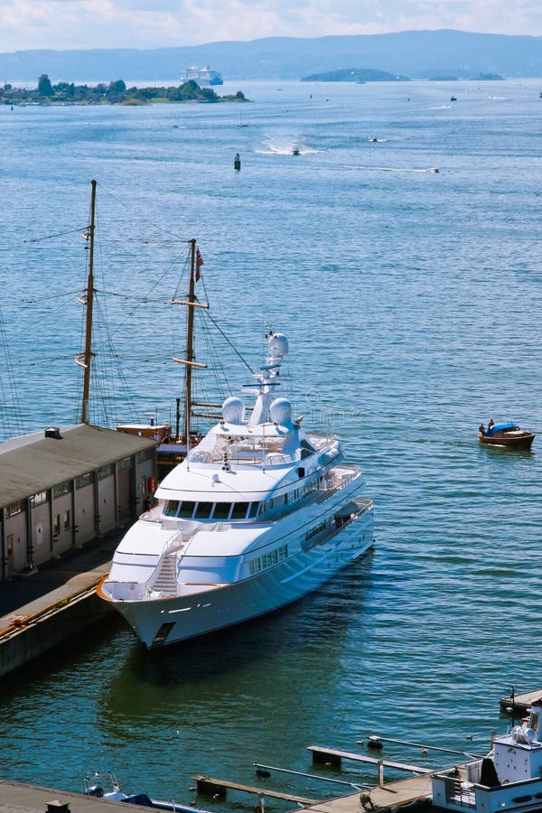 Huge luxury yacht in harbour, aerial view. Huge luxury yacht in harbour, aerial view.