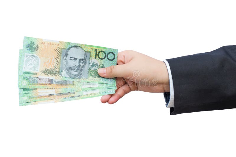 Рука бизнесмена держа австралийские доллары (AUD) на изолированной предпосылке стоковые изображения Рука бизнесмена держа австралийские доллары (AUD) на изолированной предпосылке стоковые изображения