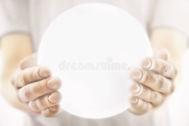 Male hands holding illuminated sphere. Male hands holding illuminated sphere